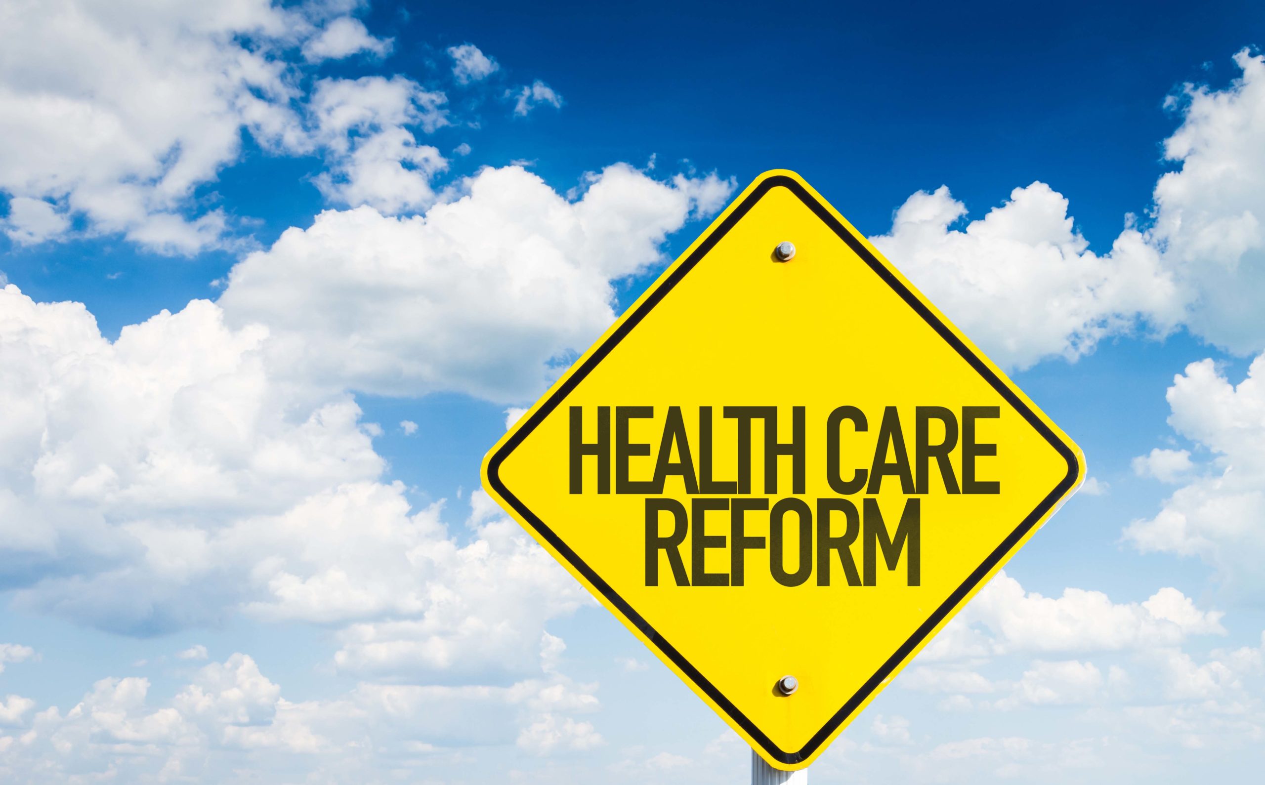 Health Care Reform sign with sky background